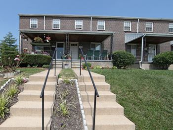 Front yard and a porch at Foxridge Townhomes, Baltimore, MD